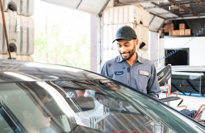 Service technician assisting a customer at a car center